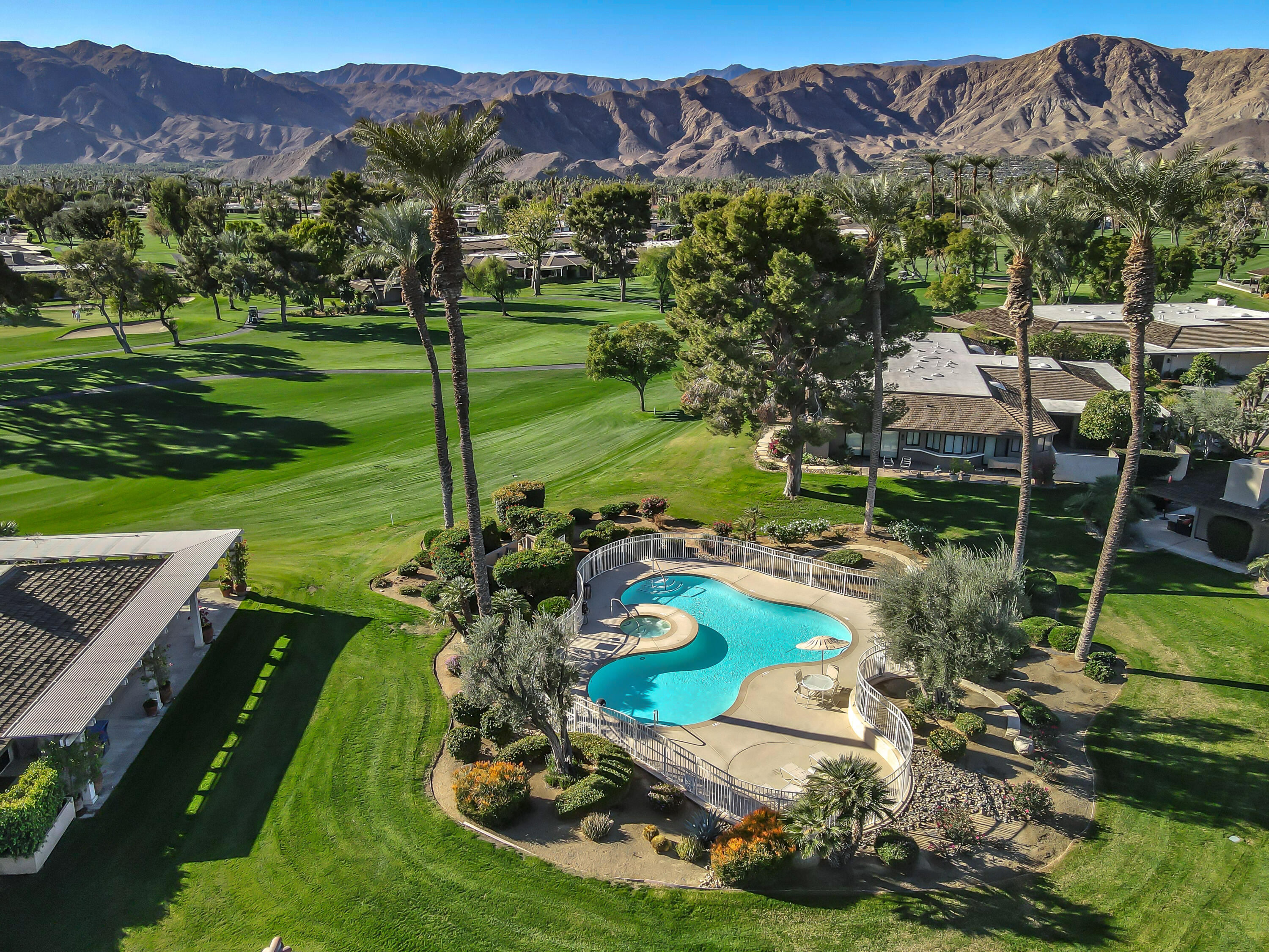 9 Swarthmore Court Rancho Mirage, CA 92270 - Photo 30 of 43 a view of a house with a yard and a garden