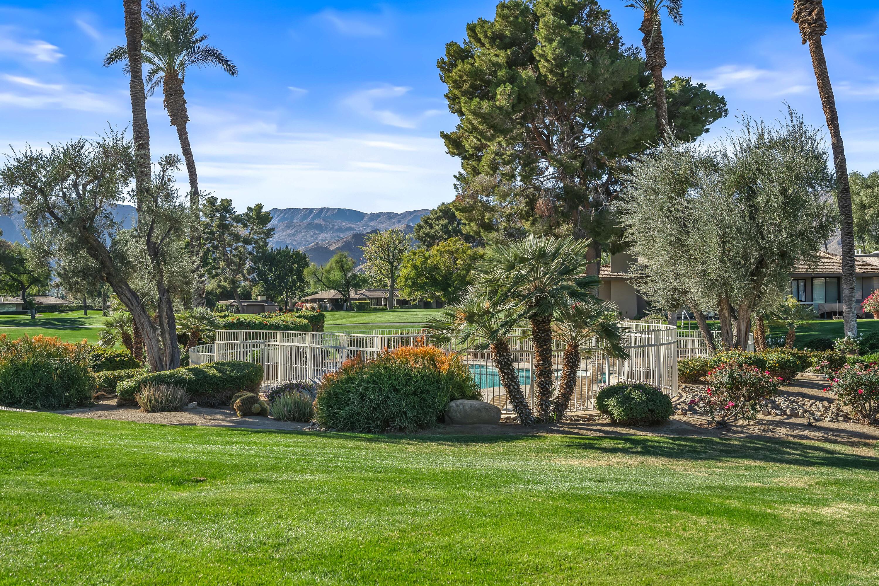 9 Swarthmore Court Rancho Mirage, CA 92270 - Photo 31 of 43 a backyard of a house with lots of green space