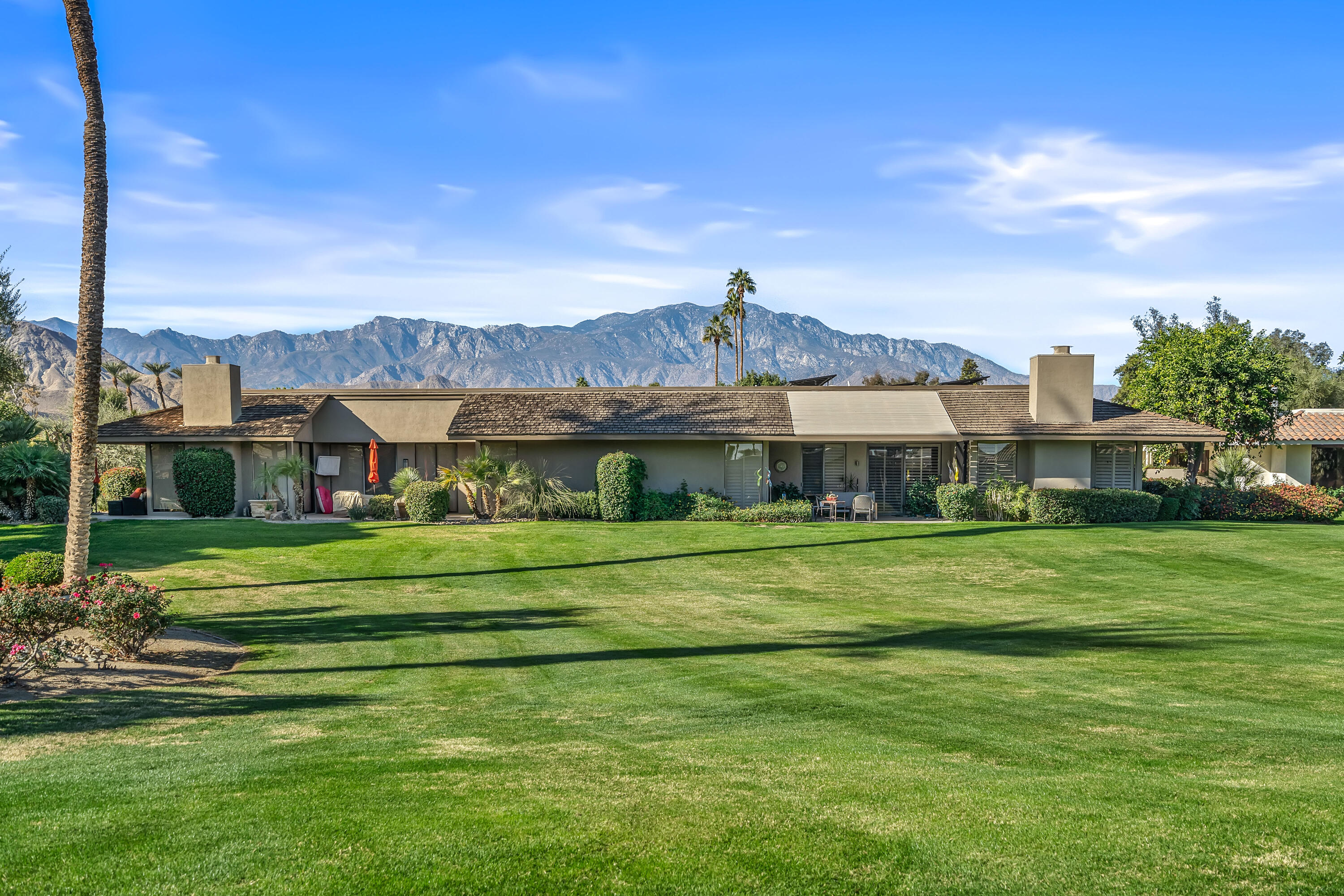 9 Swarthmore Court Rancho Mirage, CA 92270 - Photo 32 of 43 a front view of a house with a big yard