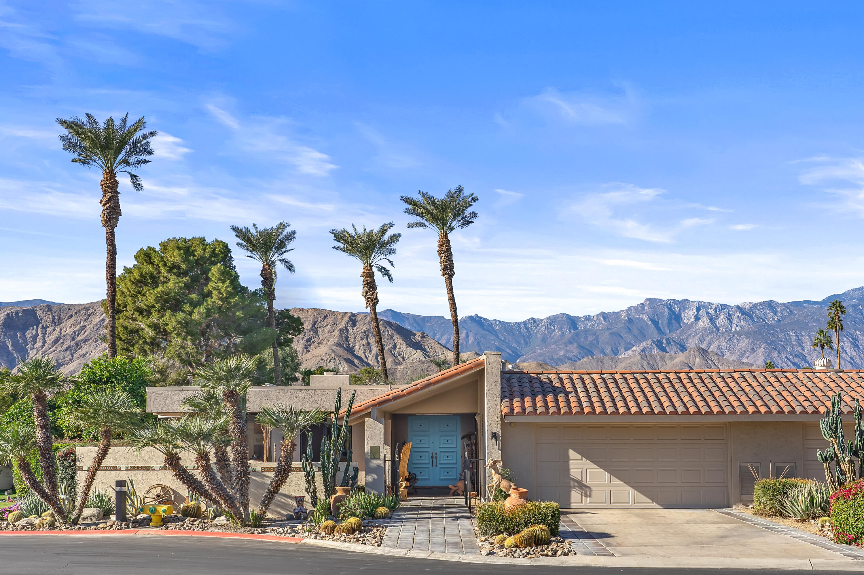 9 Swarthmore Court Rancho Mirage, CA 92270 - Photo 35 of 43 a view of a street with potted plants