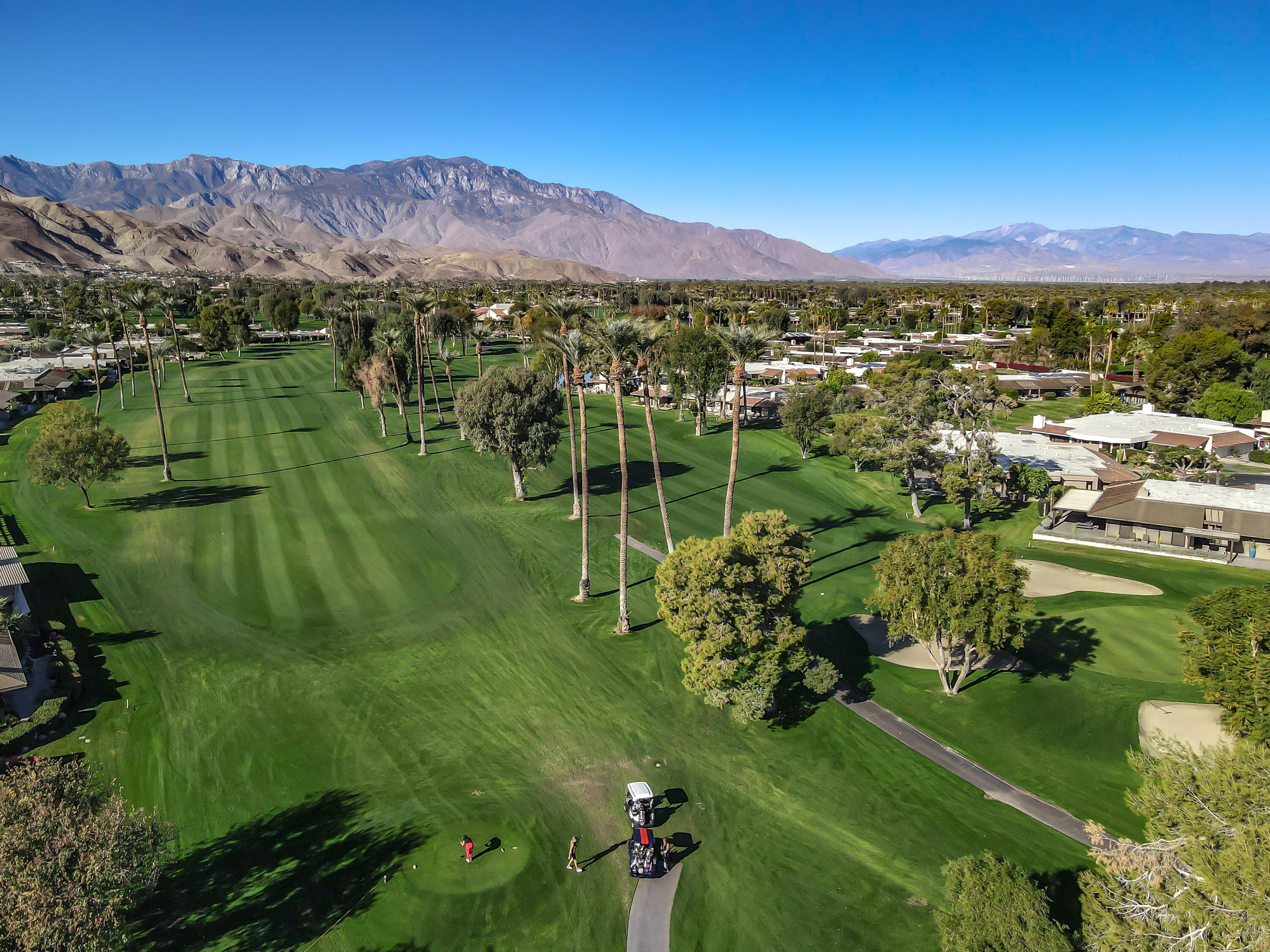 9 Swarthmore Court Rancho Mirage, CA 92270 - Photo 38 of 43 a view of a lake with a mountain in the background