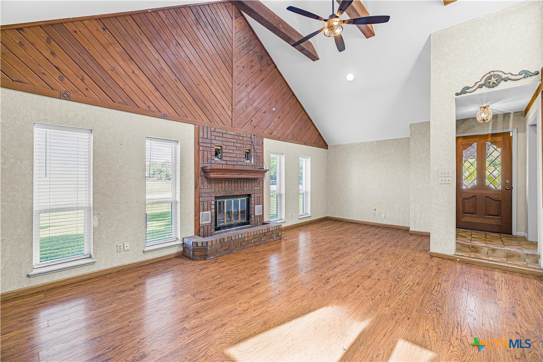 20 Hambleton Road Victoria, TX 77905 - Photo 7 of 48 a view of empty room with wooden floor and fireplace