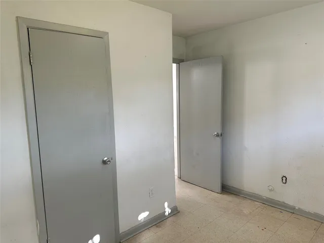 an entryway at a room with a mirror