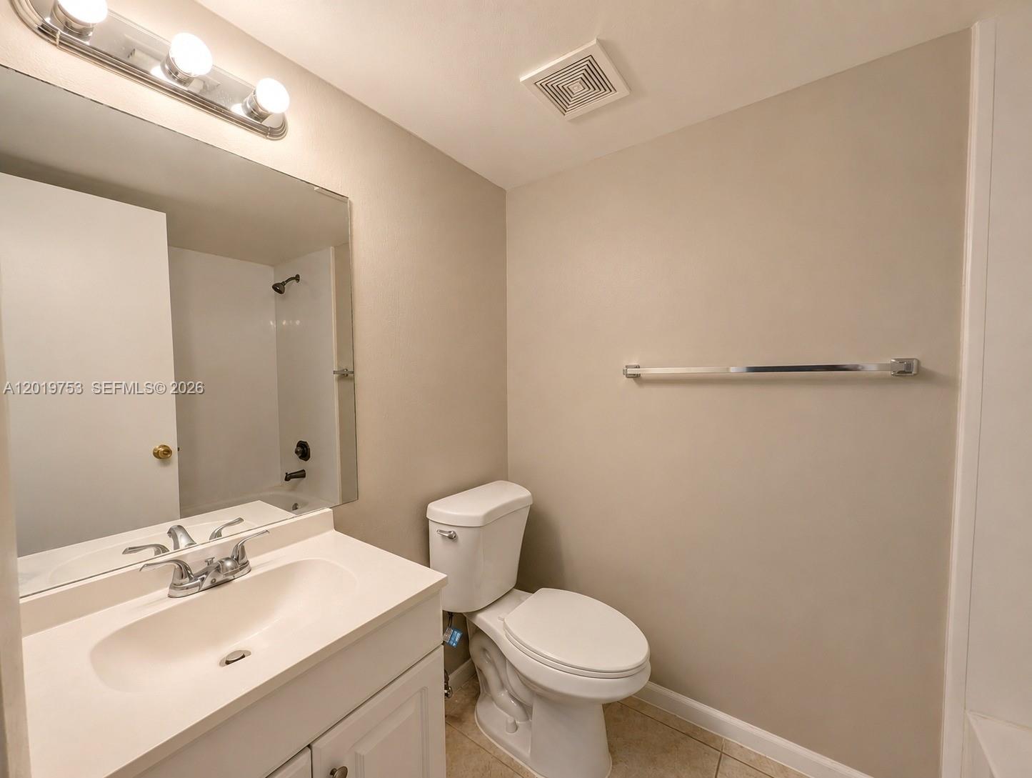 3410 Foxcroft Road, Unit 206 Miramar, FL 33025 - Photo 17 of 23 a bathroom with a sink toilet and vanity