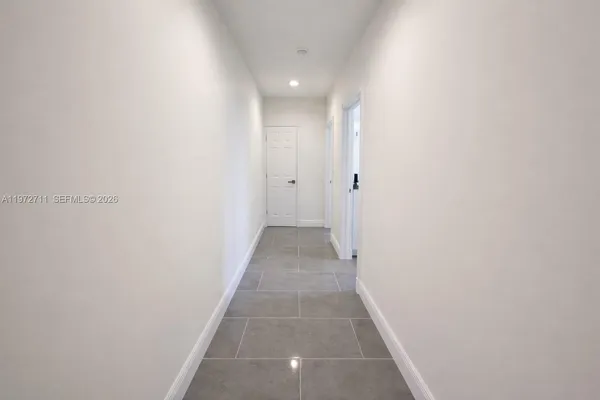 a bathroom with a double vanity sink toilet and shower