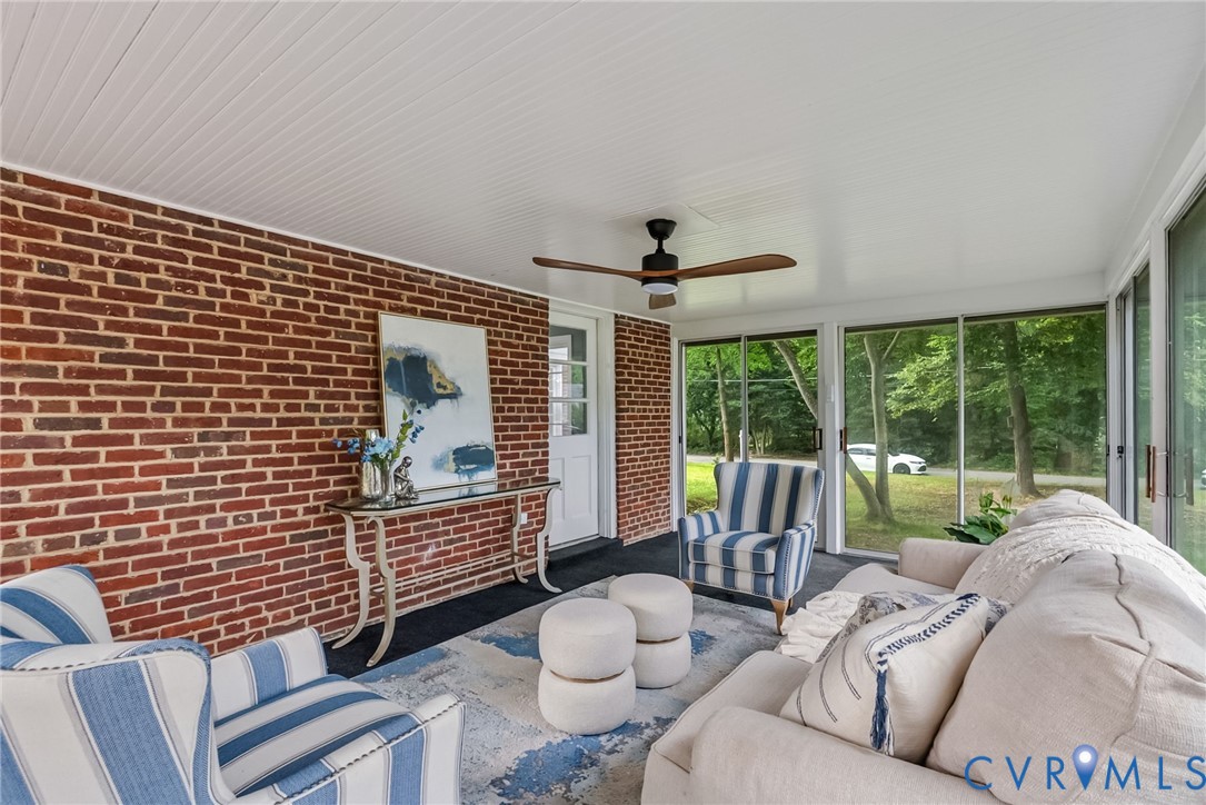 1136 Overbrook Road Petersburg, VA 23805 - Photo 41 of 51 Sunroom featuring exposed brick wall, beadboard ce