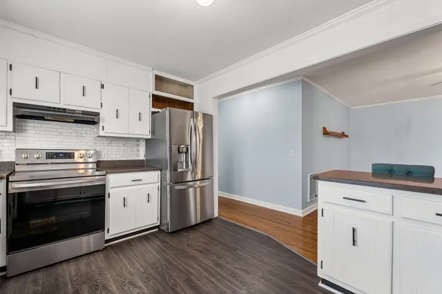 a bathroom with a sink toilet and window