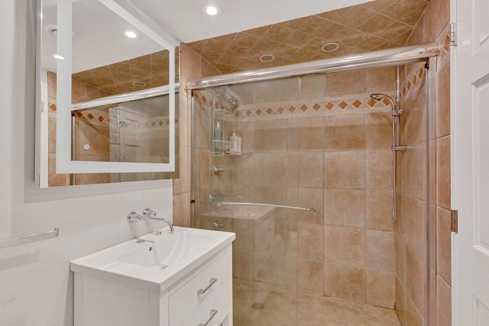 1 East Schiller Street, Unit 12A Chicago, IL 60610 - Photo 11 of 13 a bathroom with a shower and a sink