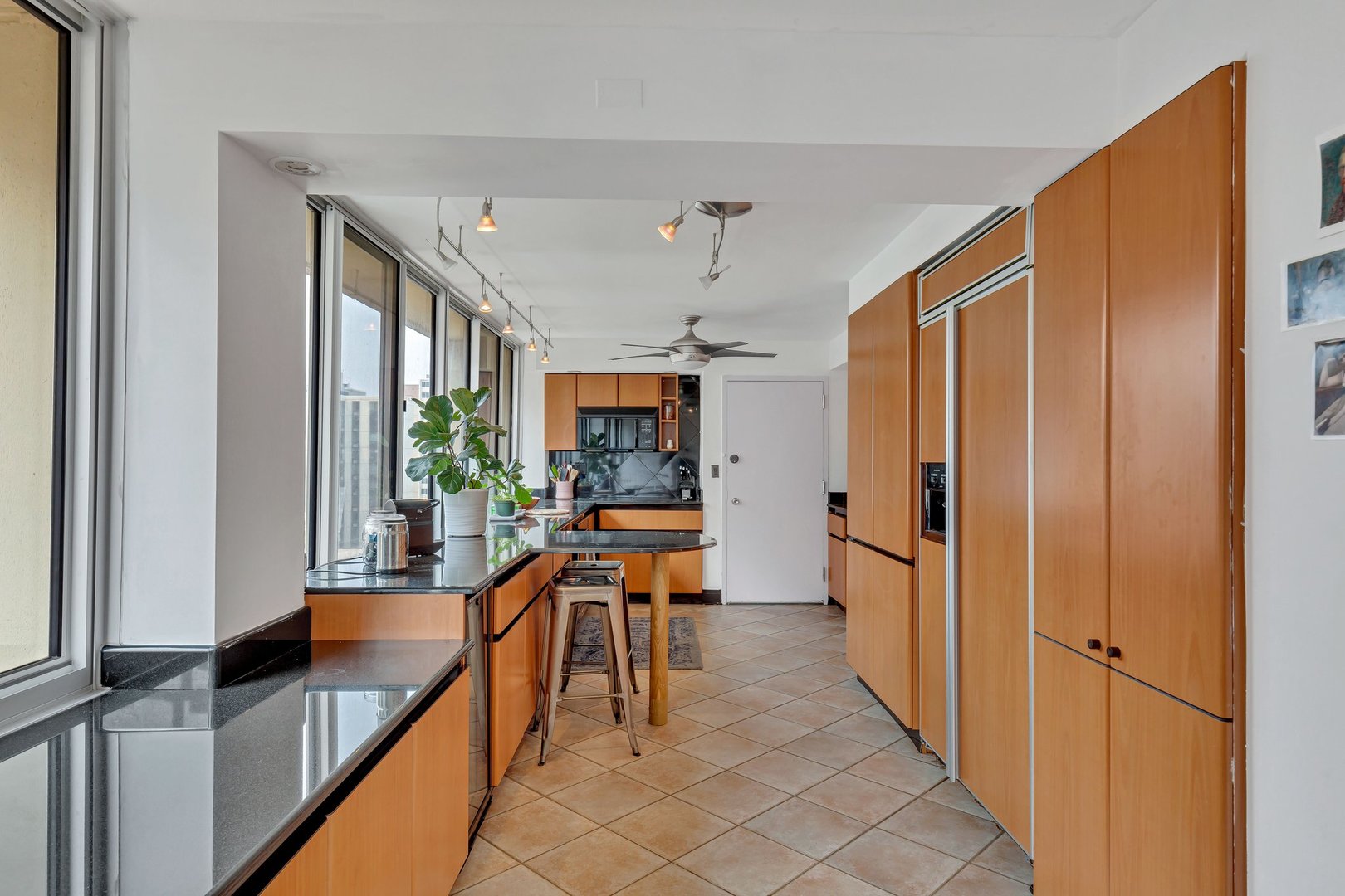 1 East Schiller Street, Unit 12A Chicago, IL 60610 - Photo 3 of 13 a very nice looking room with a large window and wooden floor
