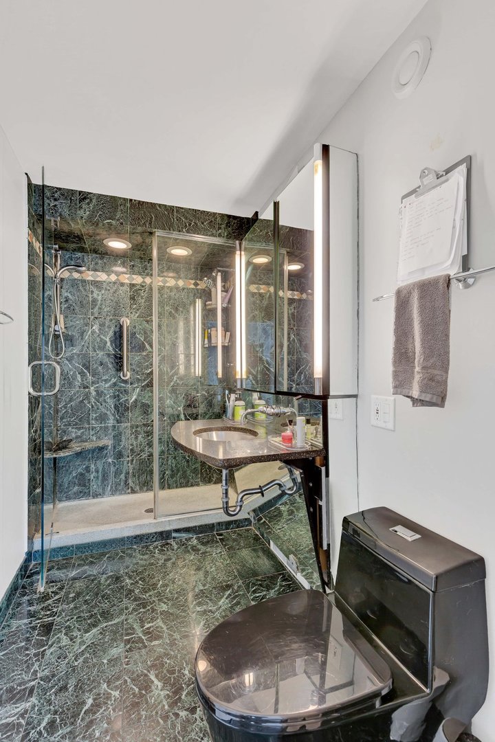 1 East Schiller Street, Unit 12A Chicago, IL 60610 - Photo 10 of 13 a room with a table and chairs