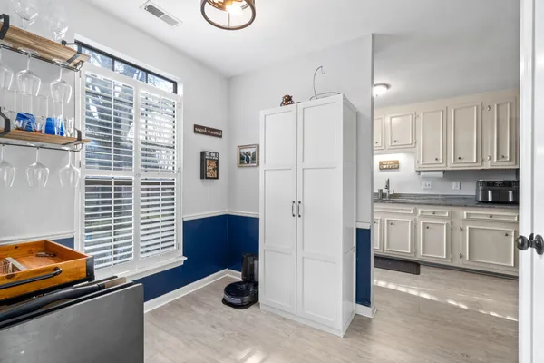 a kitchen with stainless steel appliances granite countertop a refrigerator and a stove