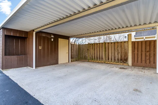 an empty room with wooden walls