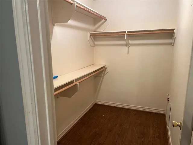 a view of storage and utility room with racks on the wall