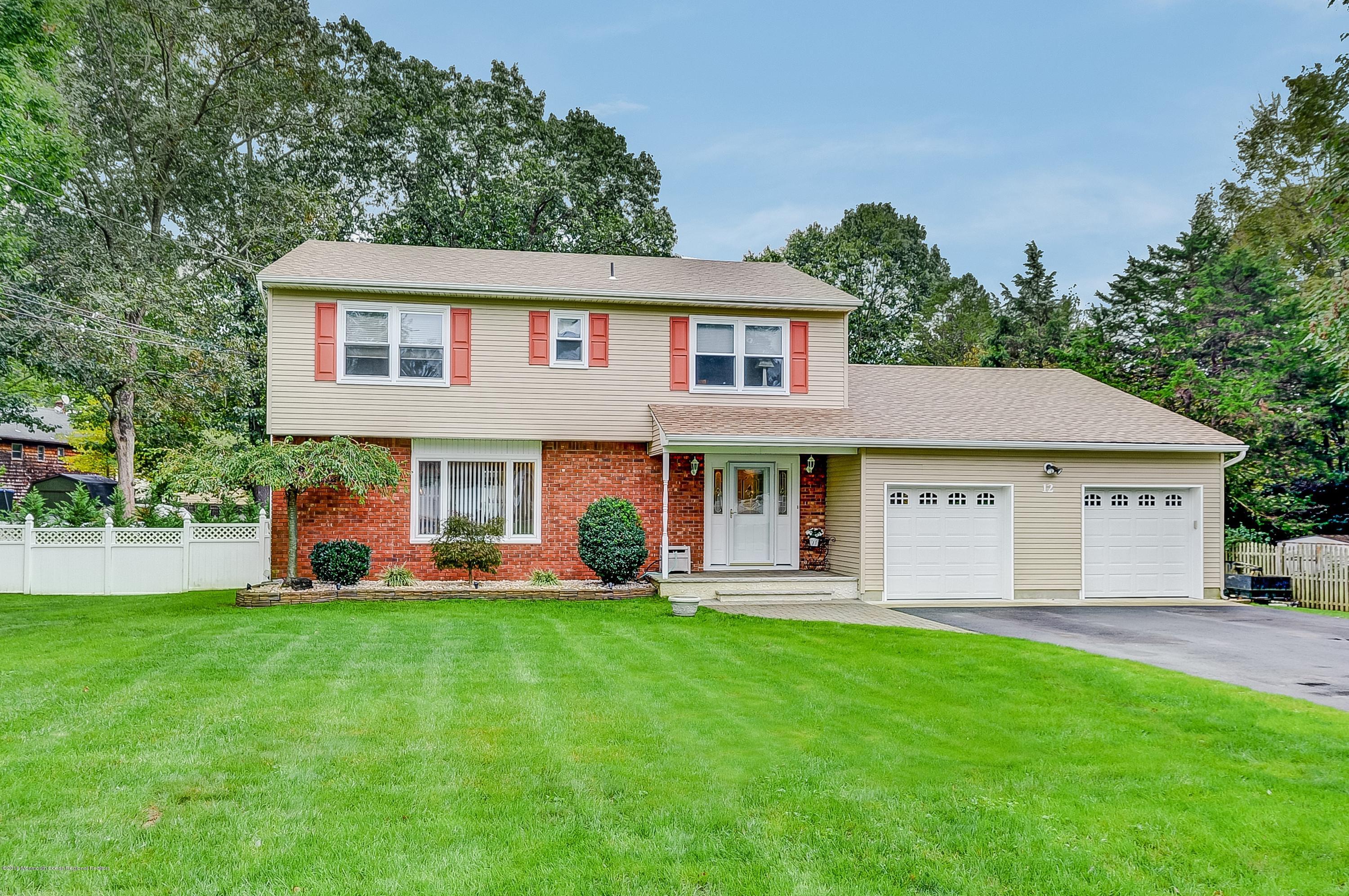 12 Addison Road Howell, NJ 07731 - Photo 1 of 25 a front view of a house with a yard and trees