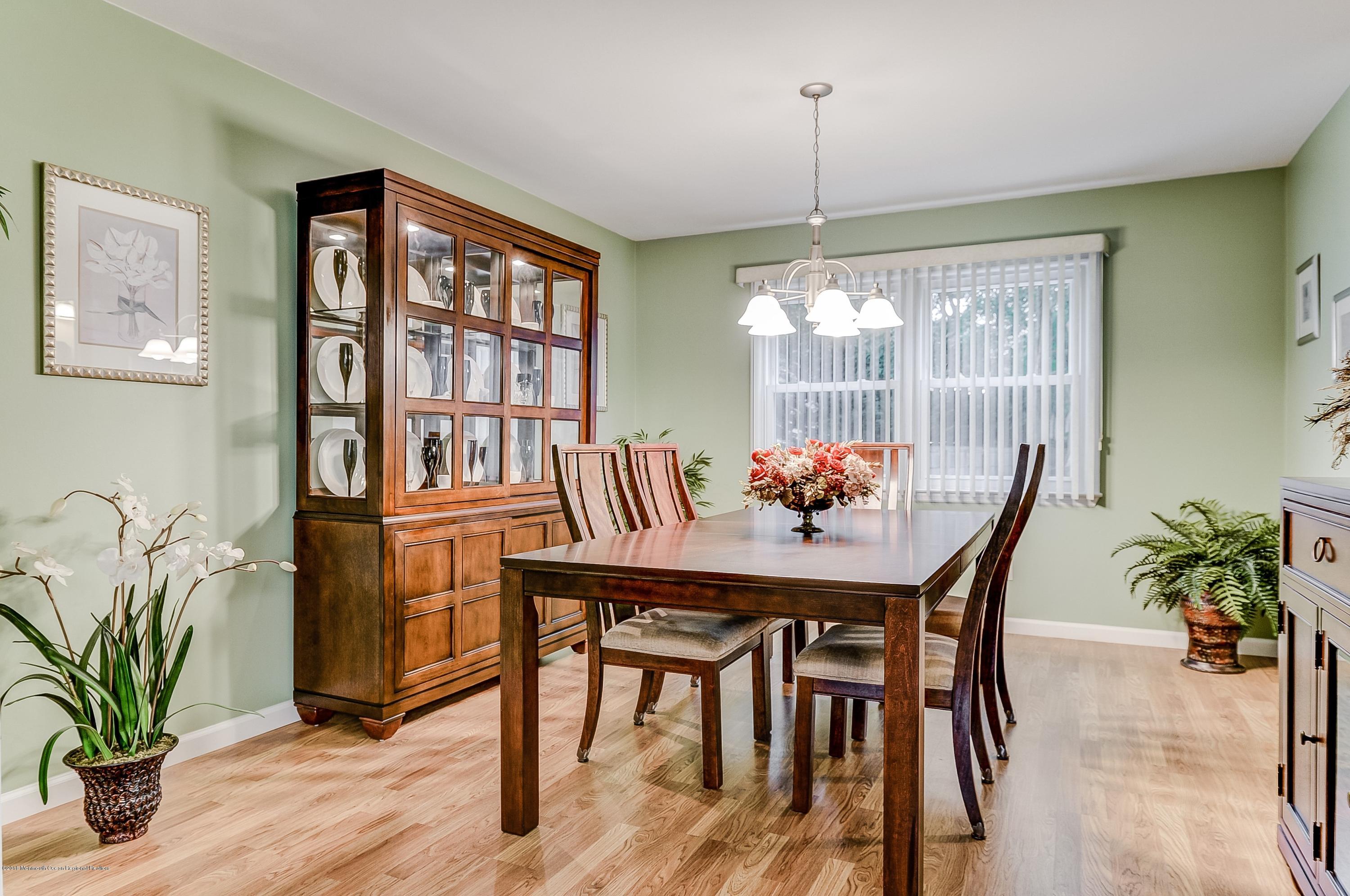 12 Addison Road Howell, NJ 07731 - Photo 11 of 25 a view of a dining room with furniture window and wooden floor