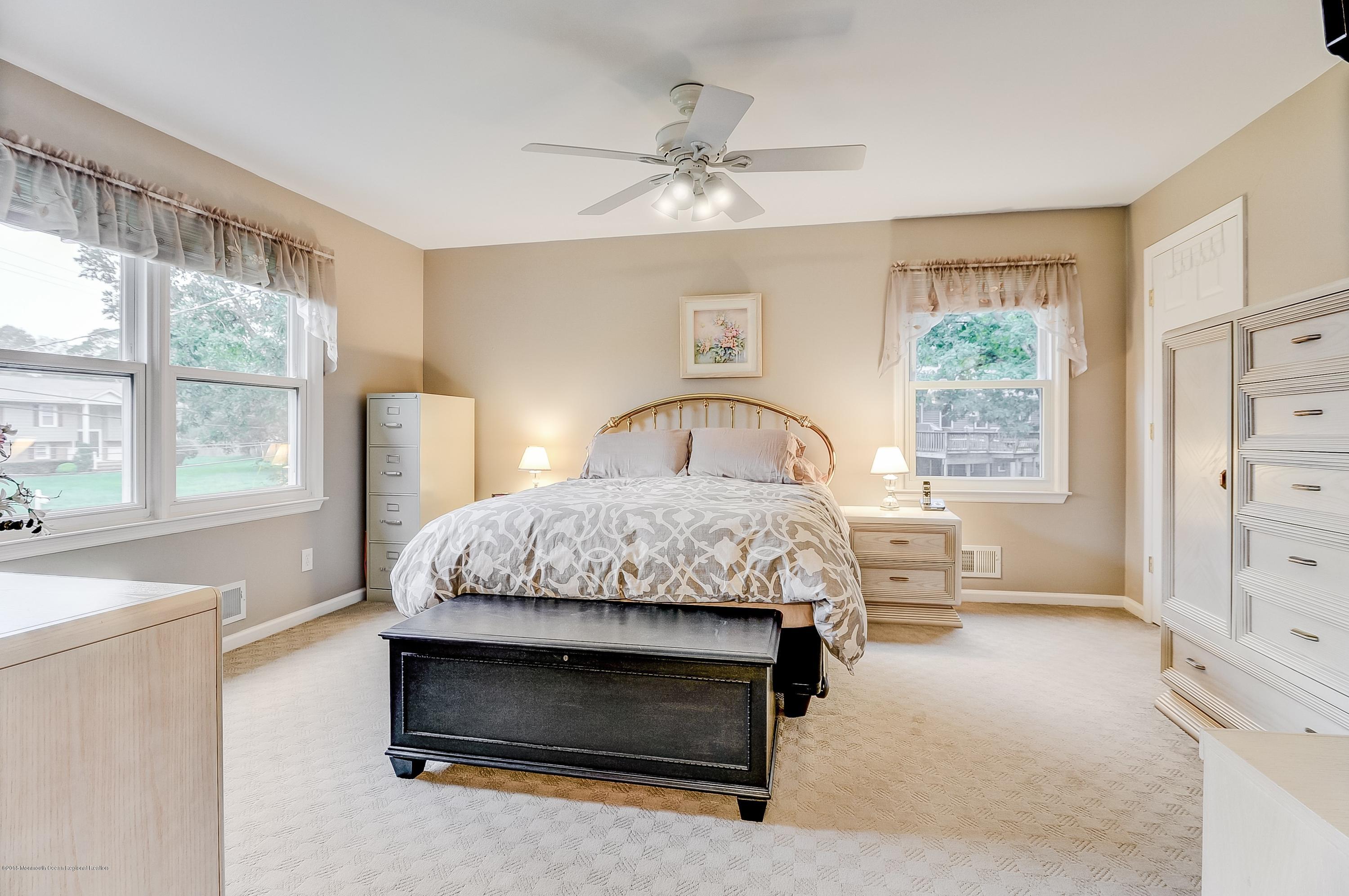12 Addison Road Howell, NJ 07731 - Photo 15 of 25 a bedroom with a bed and a dresser next to a window