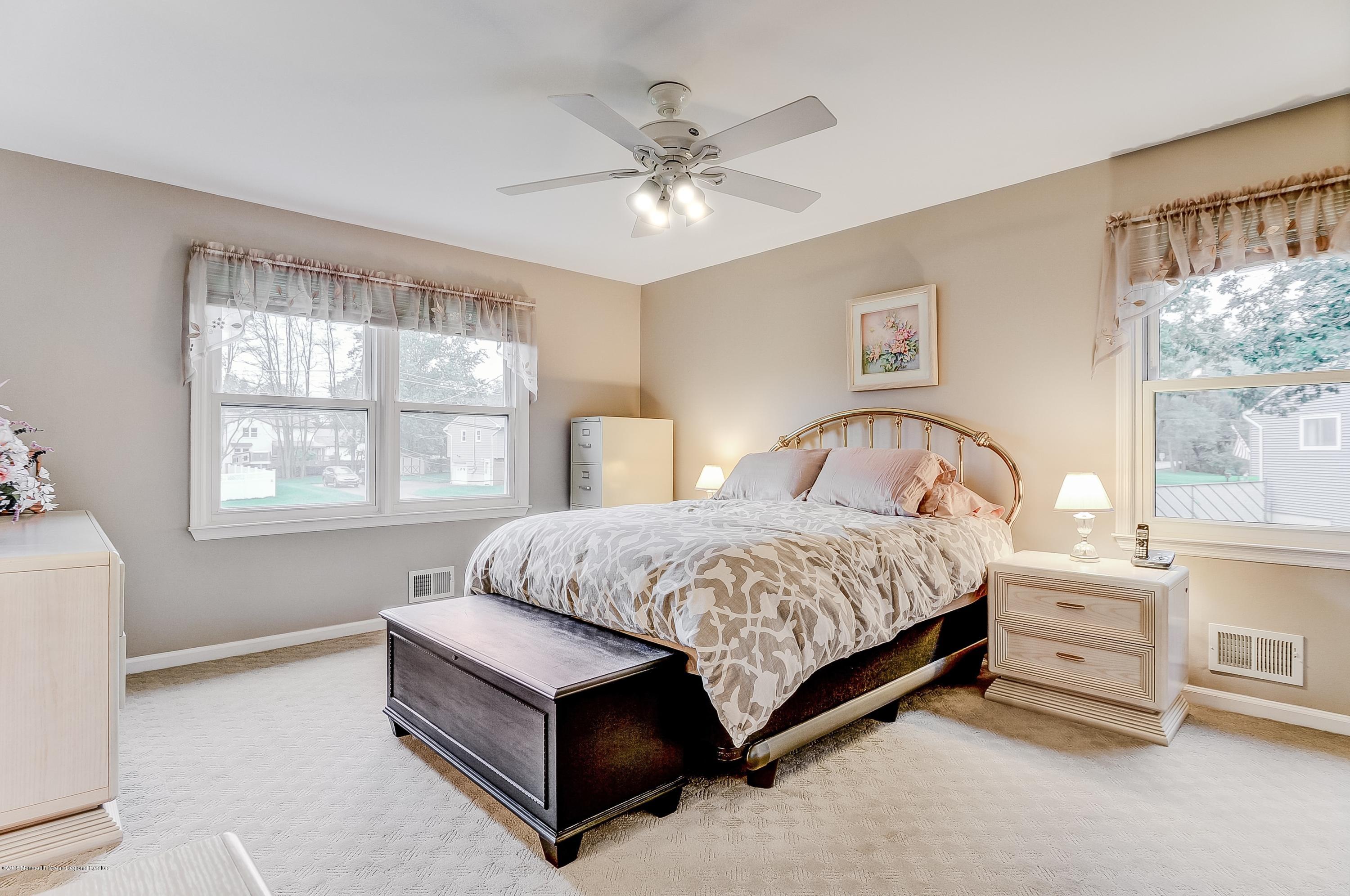 12 Addison Road Howell, NJ 07731 - Photo 16 of 25 a spacious bedroom with a bed and a window