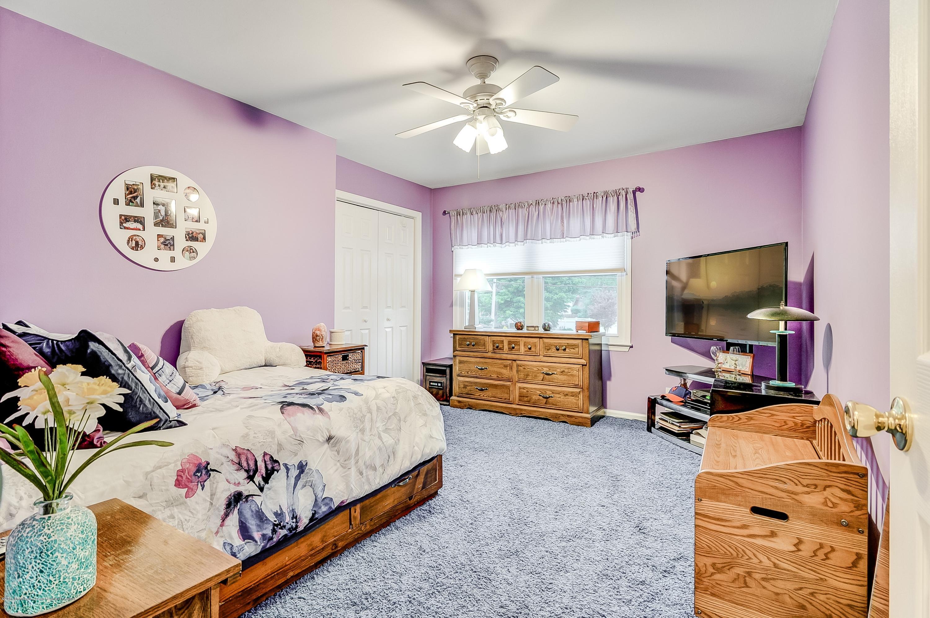 12 Addison Road Howell, NJ 07731 - Photo 20 of 25 a bedroom with a bed and a flat screen tv