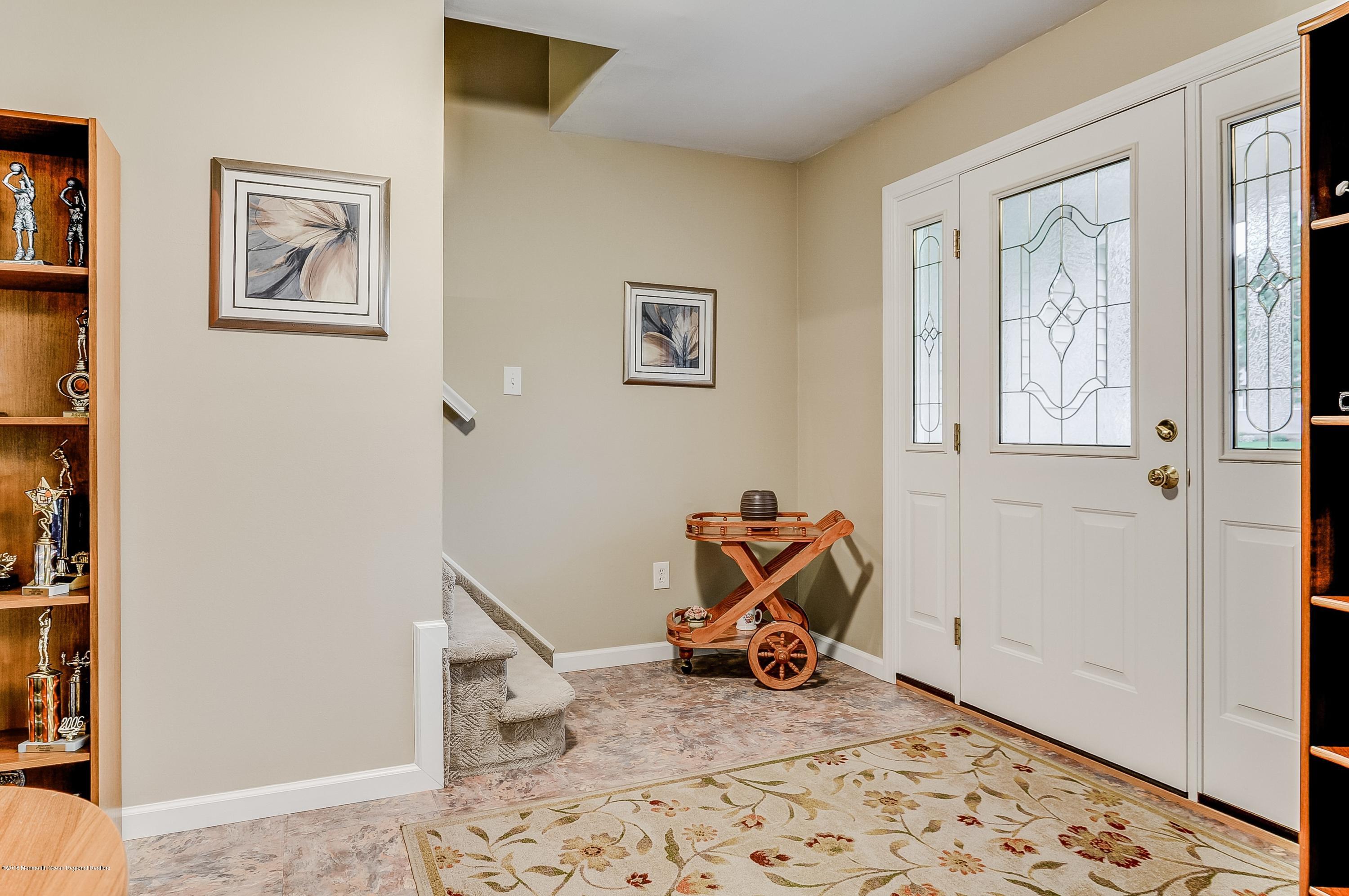 12 Addison Road Howell, NJ 07731 - Photo 2 of 25 a view of a livingroom with wooden floor and a window