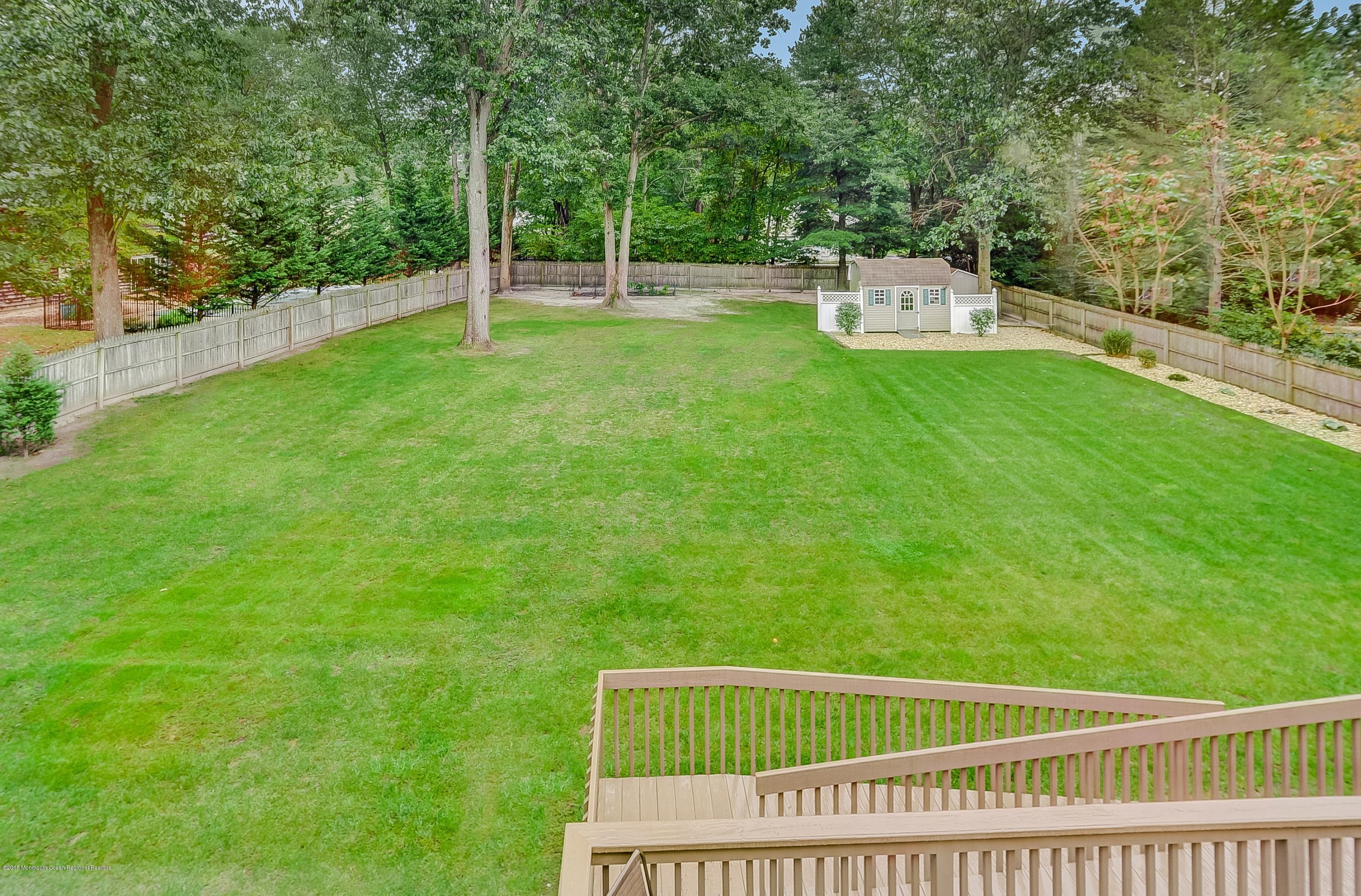 12 Addison Road Howell, NJ 07731 - Photo 24 of 25 a view of a deck with a small yard