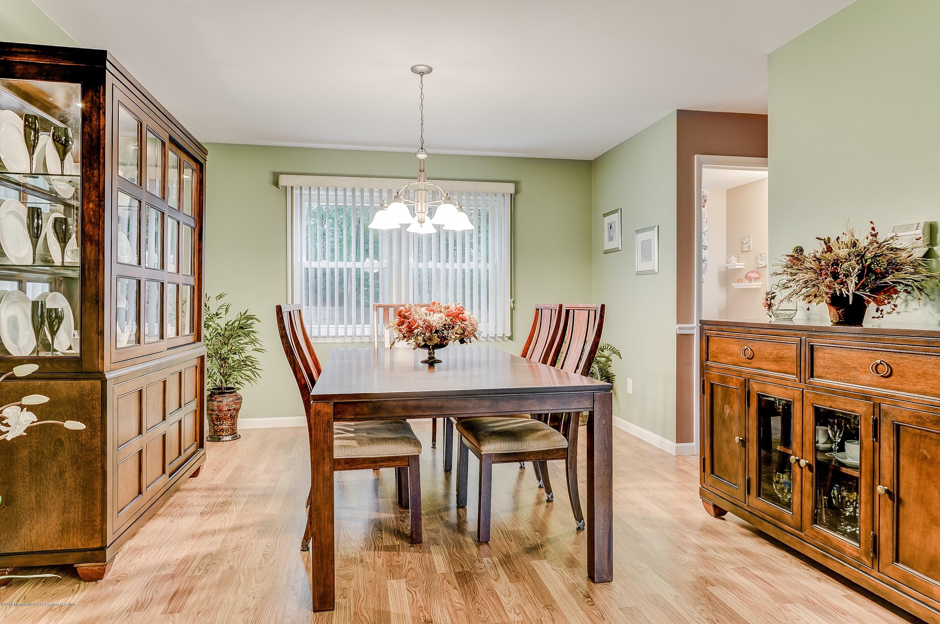 12 Addison Road Howell, NJ 07731 - Photo 10 of 25 a view of a dining room with furniture window and wooden floor