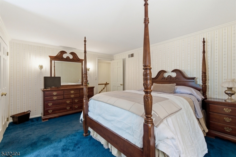 13 Hamden Road Flemington, NJ 08822 - Photo 28 of 37 a bed room with a bed and a dresser