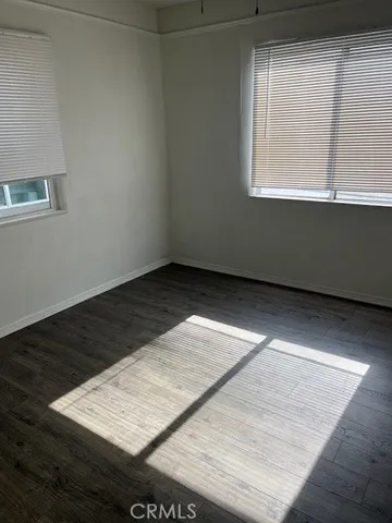 a view of balcony with wooden floor