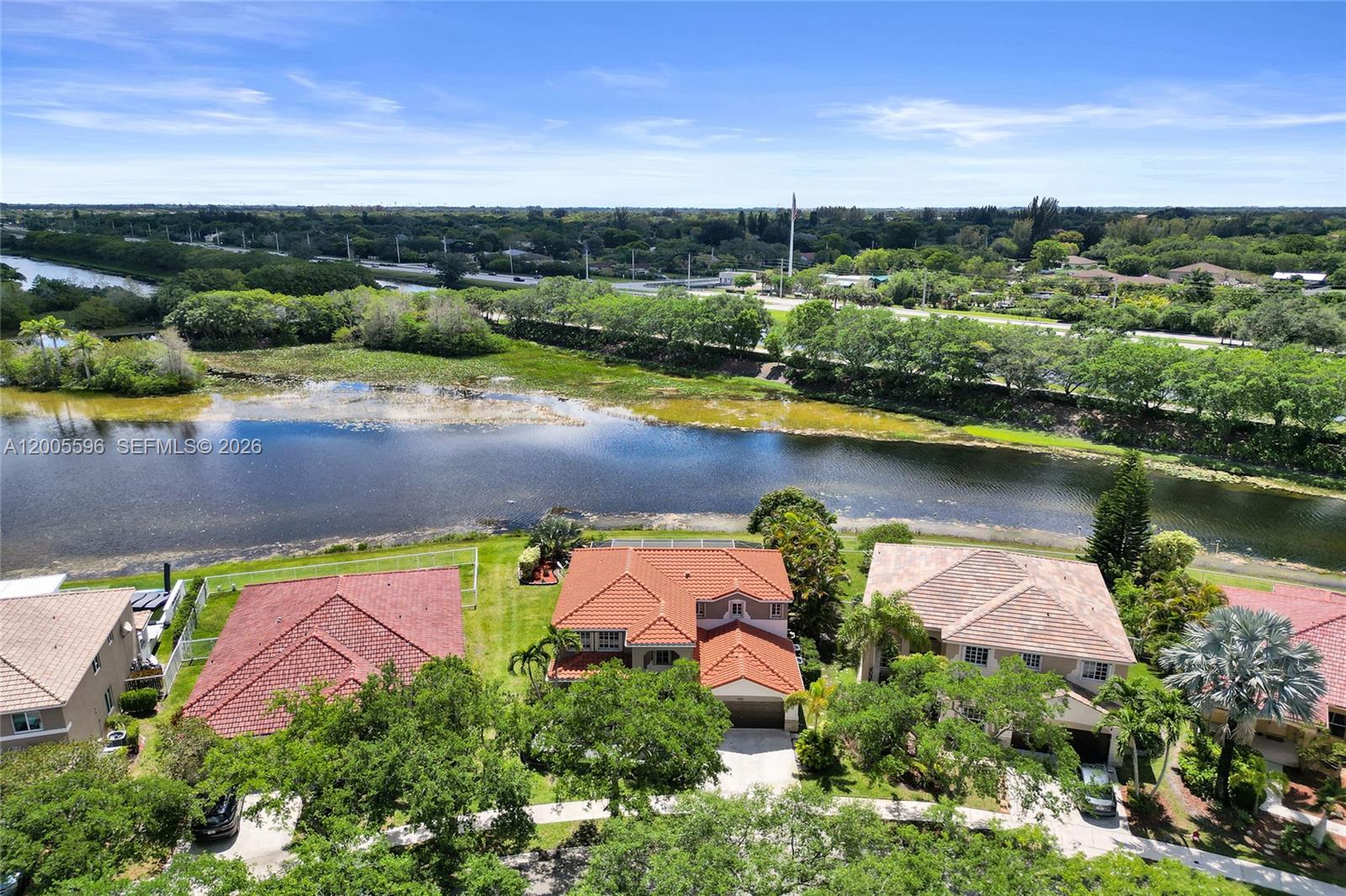 4281 Laurel Ridge Circle Weston, FL 33331 - Photo 77 of 80 an aerial view of a house with a lake view