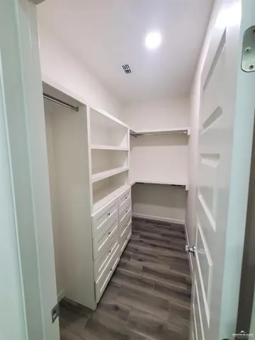 a view of an empty walk in closet