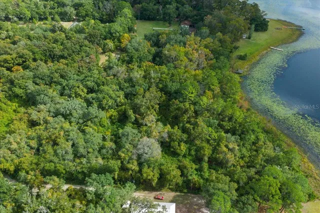 a view of a lake with a yard