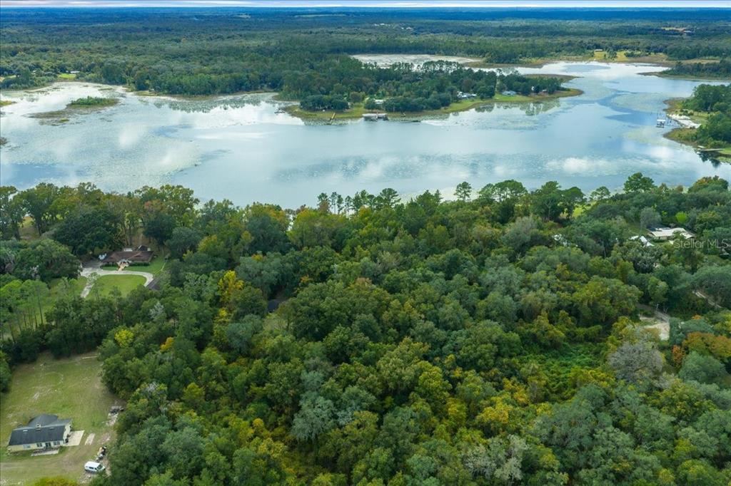7173 West R Thomas Road Keystone Heights, FL 32656 - Photo 19 of 59 a view of a lake from a yard