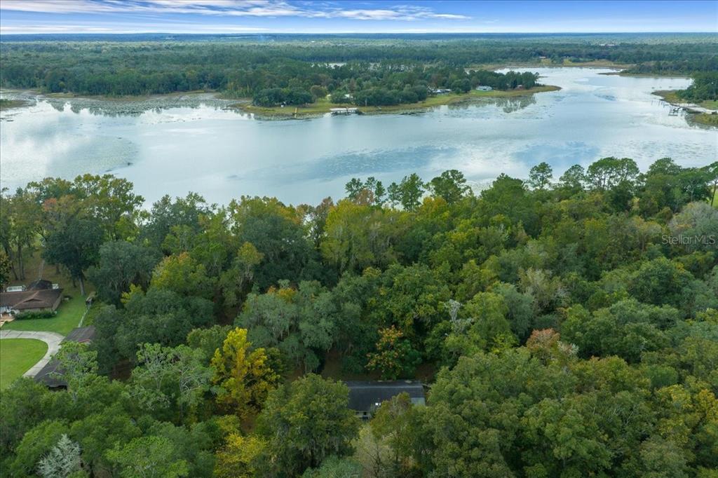 7173 West R Thomas Road Keystone Heights, FL 32656 - Photo 20 of 59 a view of a lake with a yard