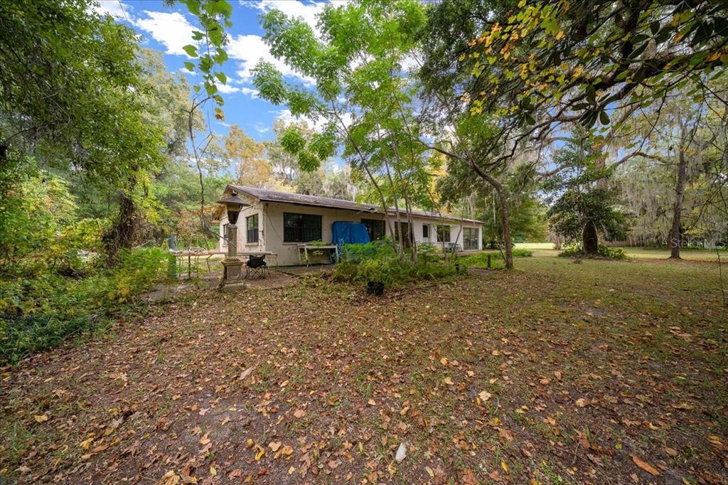 7173 West R Thomas Road Keystone Heights, FL 32656 - Photo 24 of 59 a front view of a house with a yard