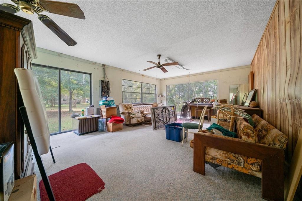 7173 West R Thomas Road Keystone Heights, FL 32656 - Photo 31 of 59 a living room with furniture and a large window
