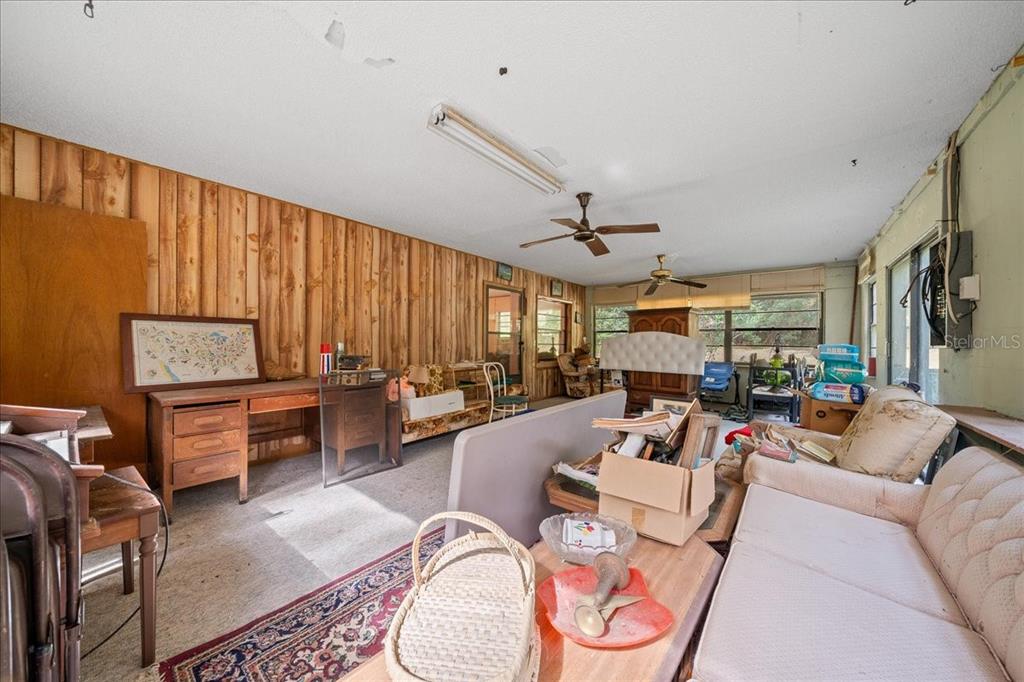 7173 West R Thomas Road Keystone Heights, FL 32656 - Photo 32 of 59 a living room with furniture and a large window