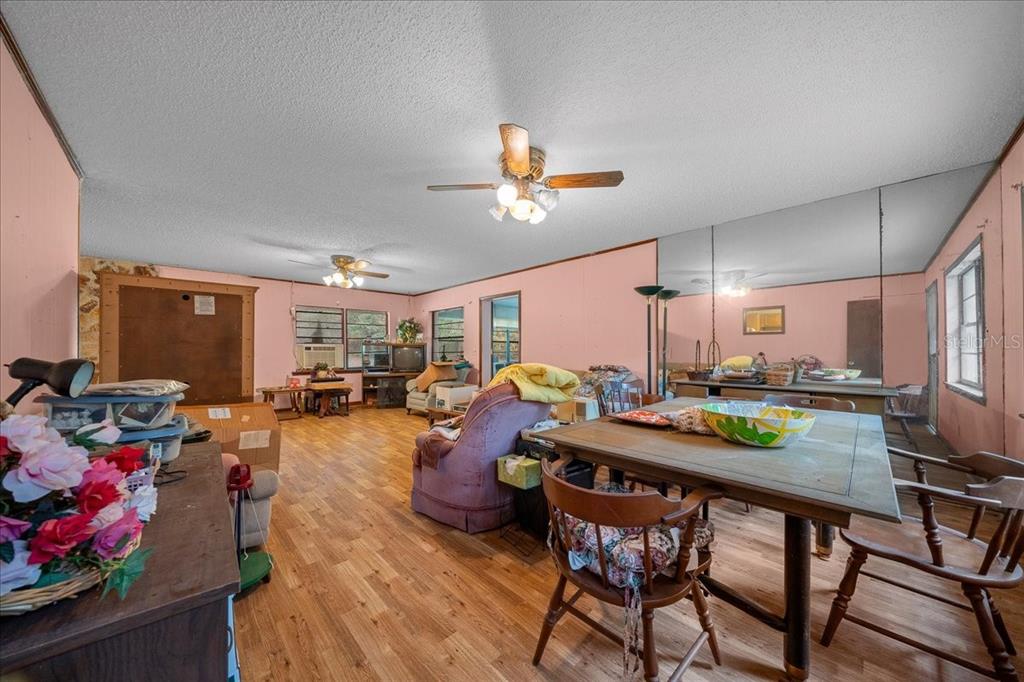 7173 West R Thomas Road Keystone Heights, FL 32656 - Photo 37 of 59 a view of a dining room with furniture a chandelier and window