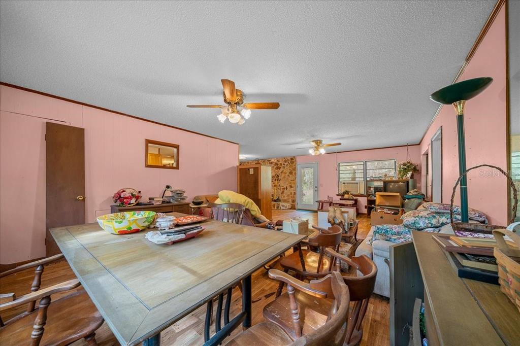 7173 West R Thomas Road Keystone Heights, FL 32656 - Photo 38 of 59 a view of a dining room with furniture and a potted plant