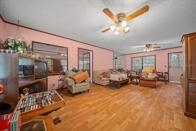 a kitchen with a sink window and cabinets