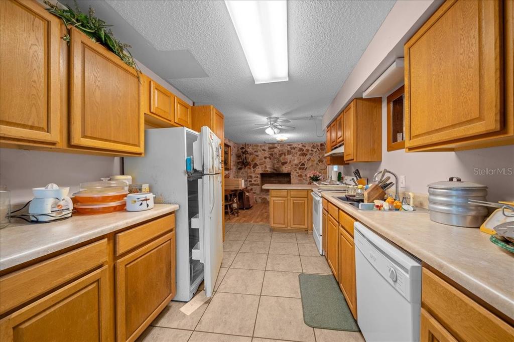 7173 West R Thomas Road Keystone Heights, FL 32656 - Photo 46 of 59 a kitchen with a sink dishwasher stove and refrigerator