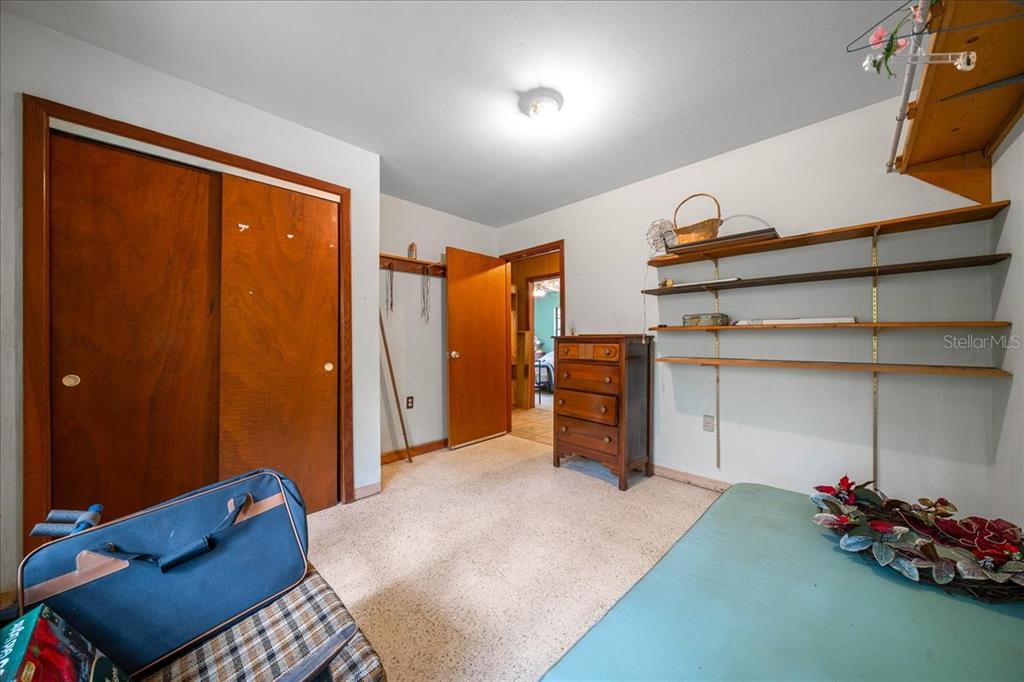 7173 West R Thomas Road Keystone Heights, FL 32656 - Photo 51 of 59 a bed room with a bed and a cabinets