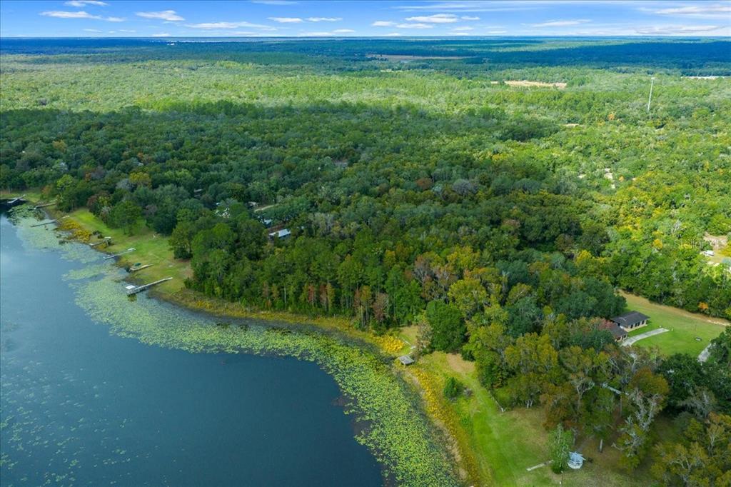 7173 West R Thomas Road Keystone Heights, FL 32656 - Photo 7 of 59 a view of a yard with a lake view