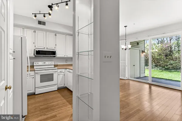 a view of cabinets and wooden floor