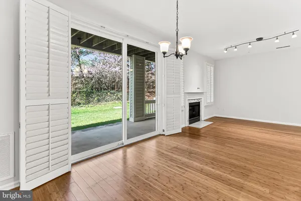 a view of a kitchen with marble kitchen and stainless steel appliances