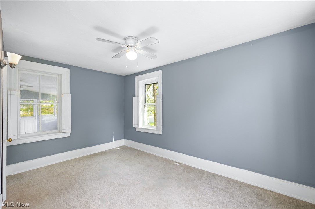 39016 Detroit Road Avon, OH 44011 - Photo 14 of 36 Spare room with carpet flooring and ceiling fan