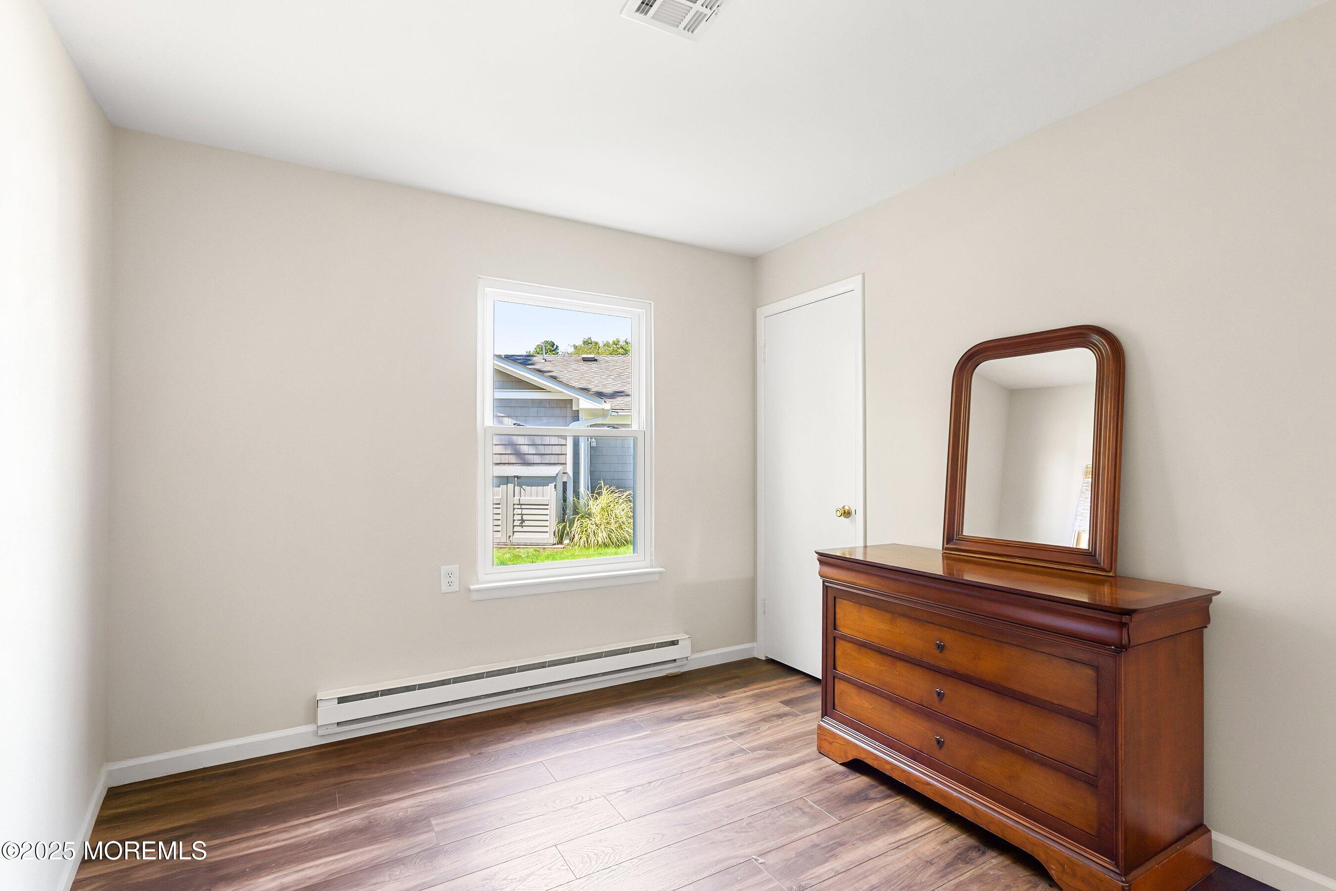 9 Whitney Court Brick, NJ 08724 - Photo 13 of 42 a view of room with wooden floor and window