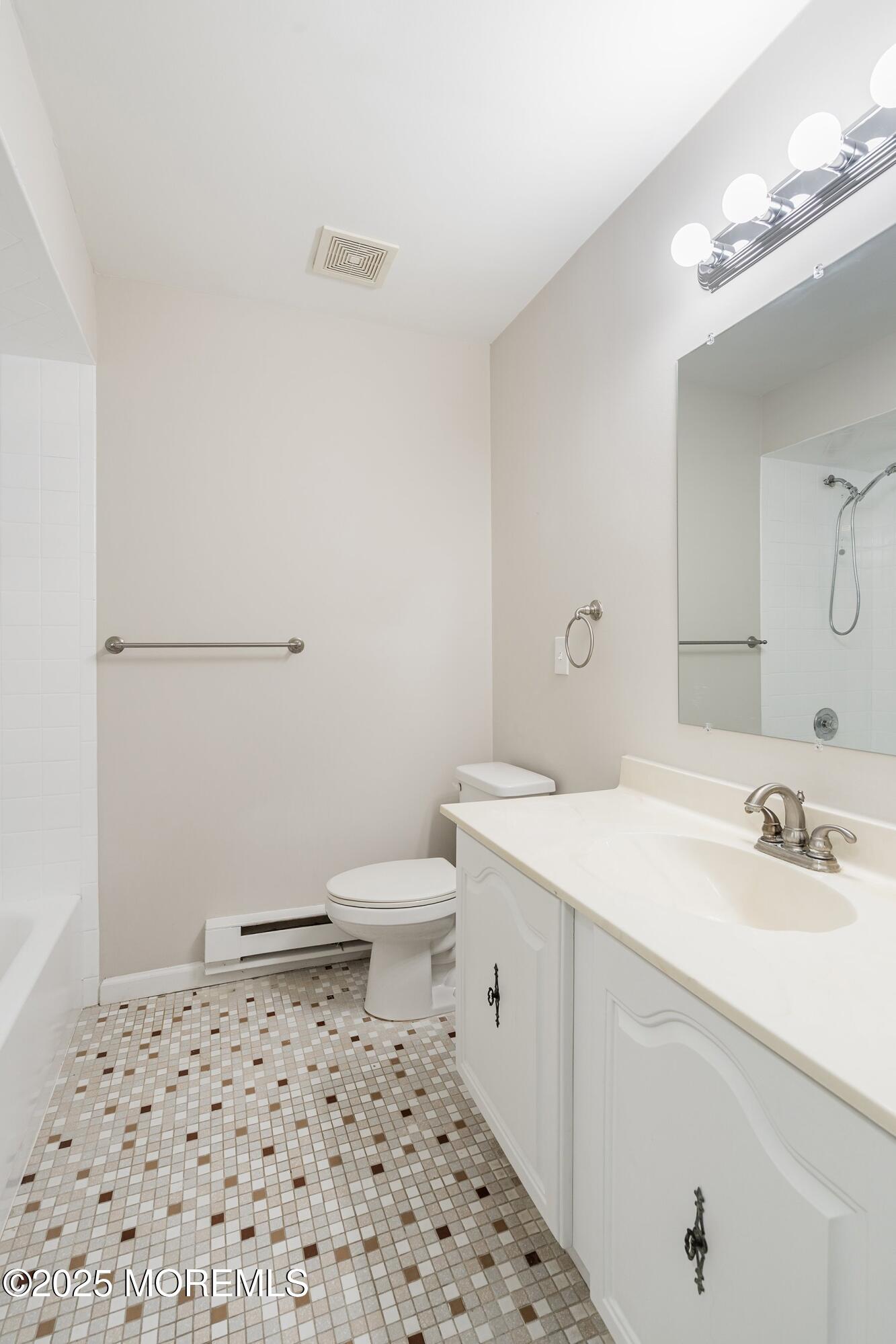 9 Whitney Court Brick, NJ 08724 - Photo 15 of 42 a bathroom with a sink a toilet a mirror and shower