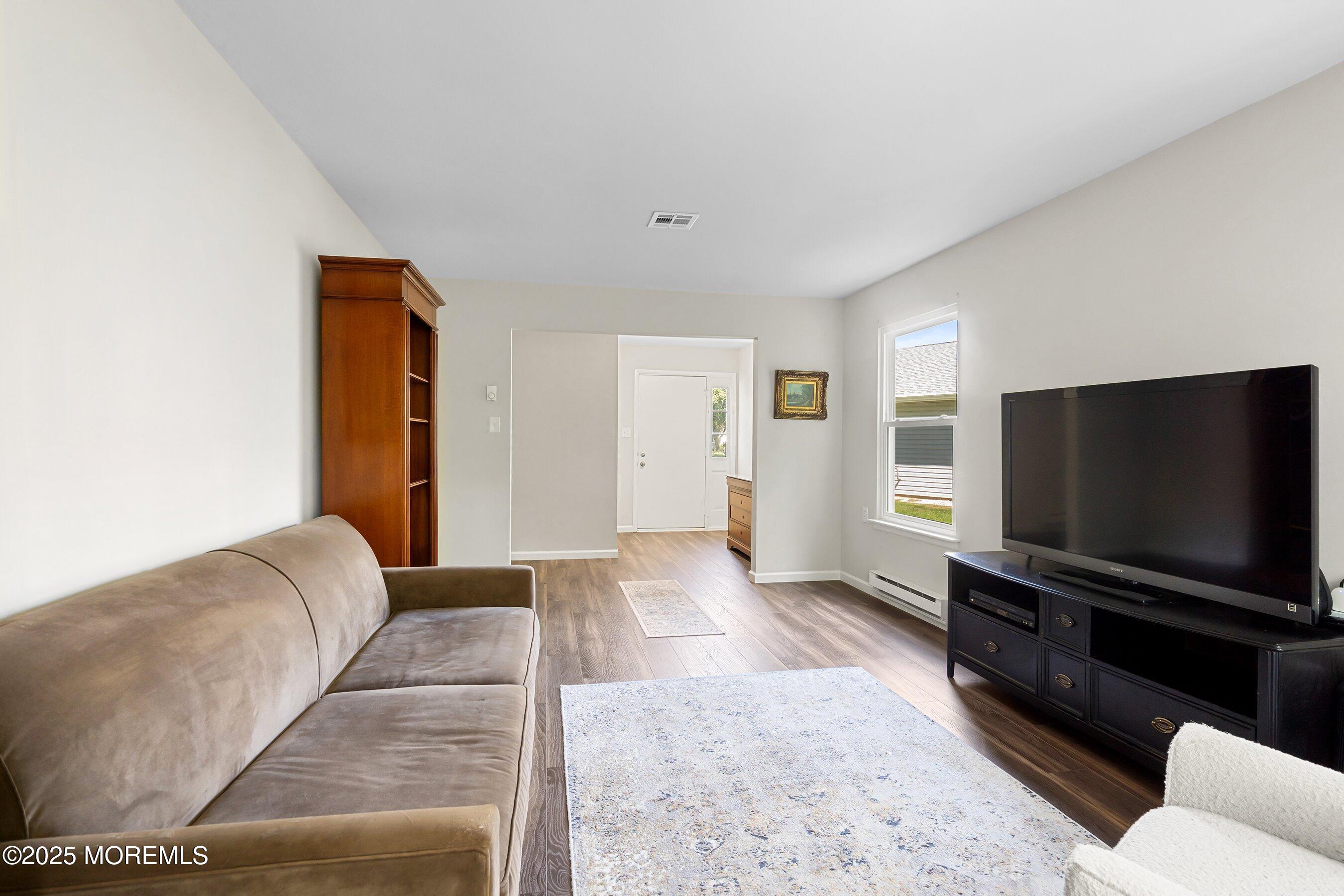 9 Whitney Court Brick, NJ 08724 - Photo 2 of 42 a living room with furniture and a flat screen tv