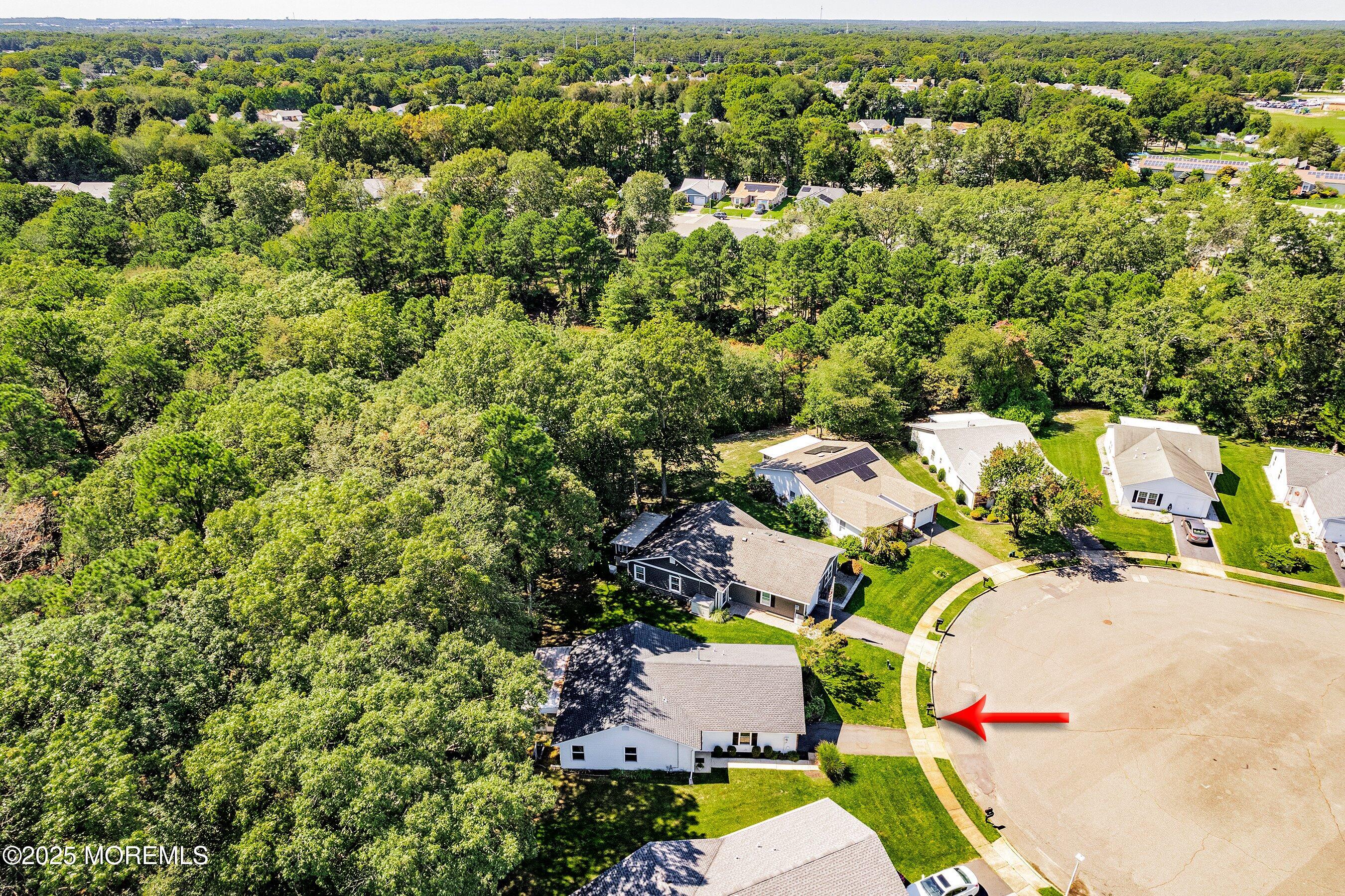 9 Whitney Court Brick, NJ 08724 - Photo 37 of 42 an aerial view of residential house with outdoor space and covered with trees