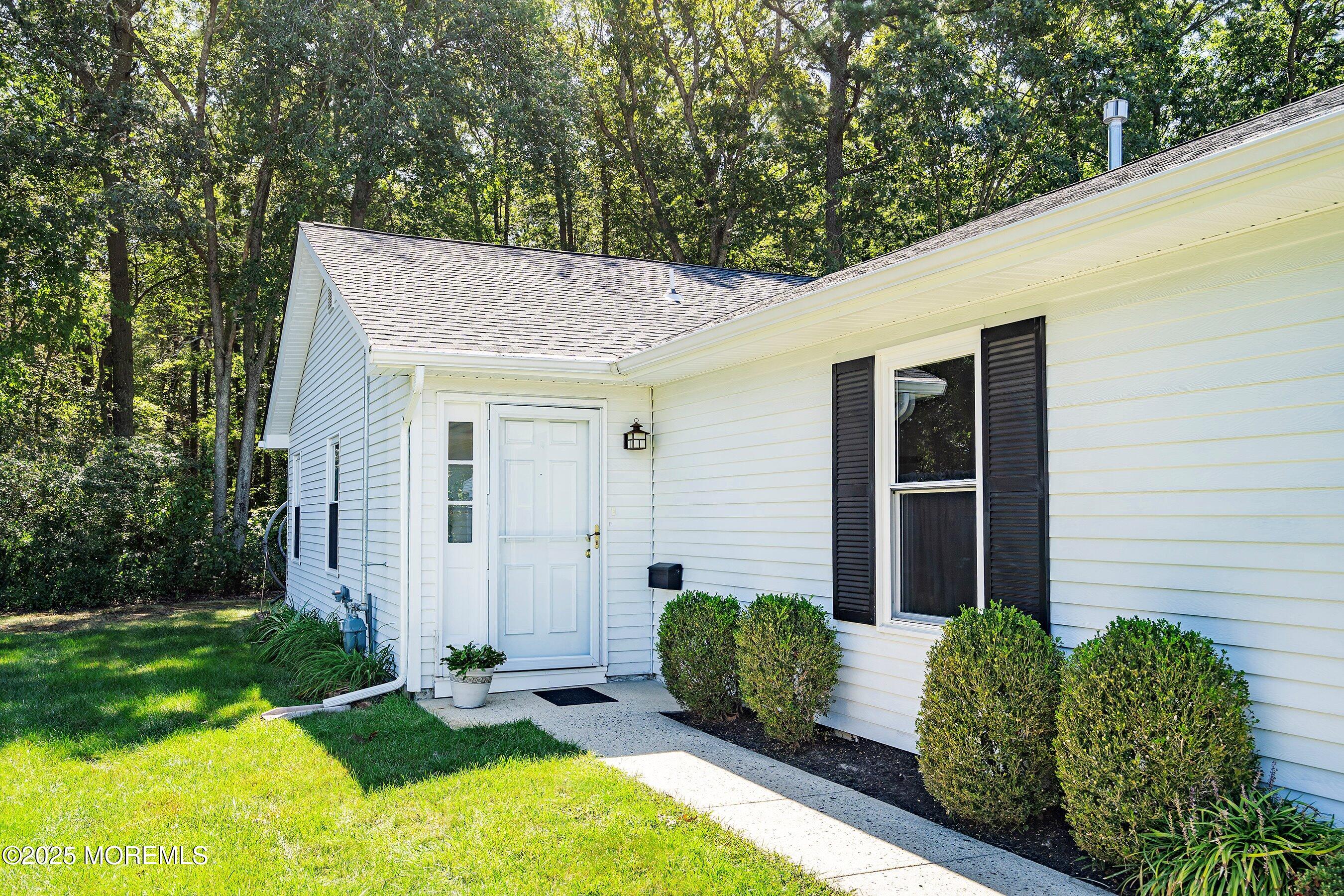 9 Whitney Court Brick, NJ 08724 - Photo 9 of 42 a view of a house with backyard and garden