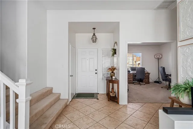 a view of livingroom with furniture and a hallway